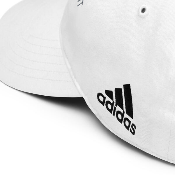 White Adidas baseball cap close-up.