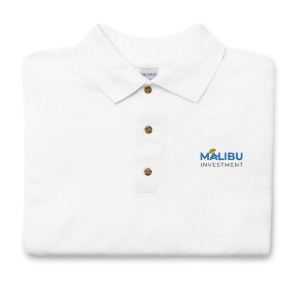 White polo shirt, Malibu Investment logo.