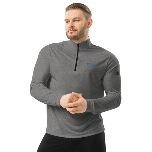 Man in gray Malibu Adidas quarter-zip.