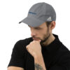 Man wearing gray Adidas Malibu boom hat.