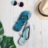 Ocean wave flip-flops and summer hat.
