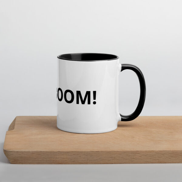 Black-handled mug; BOOM! text.